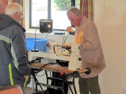 Keith Leonard turning Christmas decorations